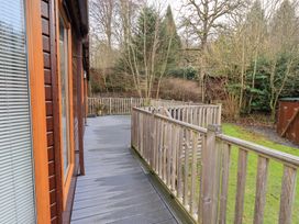 A deck area with wooden railings at Kingfisher Lodge Grasmere 33, White Cross Bay near Windermere