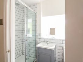 A bathroom with a shower and sink at The Old Bakery in Banbury