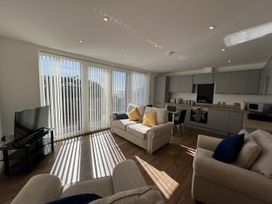 A living room with kitchen area at 2A Hamilton Road in Felixstowe