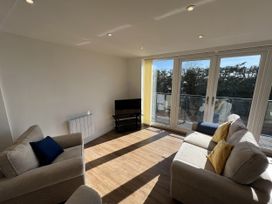A living room with sofas and a television at 2A Hamilton Road Felixstowe