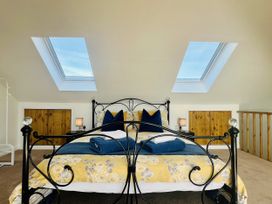 A bedroom with a bed and skylights at 2A Hamilton Road, Felixstowe