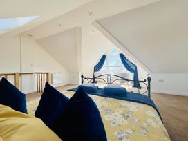 A bedroom with a bed and window at 2A Hamilton Road in Felixstowe