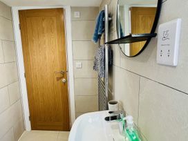 A bathroom with a sink and mirror at 2A Hamilton Road in Felixstowe