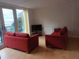A living room with sofas and a television at 2B Hamilton Road in Felixstowe