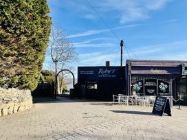 An outdoor cafe with tables and chairs at Ruby's in Felixstowe