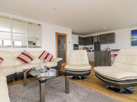 A living room with a sofa and coffee table at Praa Waves in Penzance