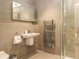 A bathroom with a sink and a shower at Praa Waves in Penzance