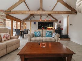 A living room with a sofa and coffee table at Pillar Barn Driffield
