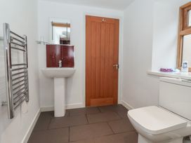 A bathroom with a sink, toilet and towel rail at Pillar Barn in Driffield