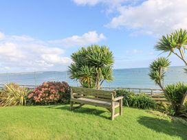 A bench overlooking the ocean at Harbour Lights in Penzance