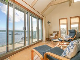 A seating area with glass doors at Harbour Lights in Penzance