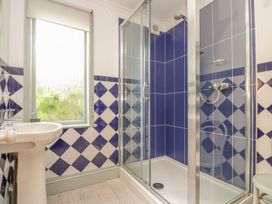 A bathroom featuring a shower and sink at Harbour Lights in Penzance