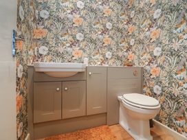 A bathroom with a sink and toilet at Waterloo Mill Cottage in Wotton-Under-Edge