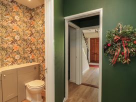 A bathroom with a toilet and vanity at Waterloo Mill Cottage in Wotton-Under-Edge