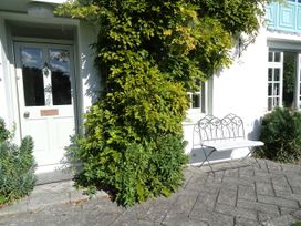 An outdoor area with a door, bench, and plants at Mount Pleasant in Padstow