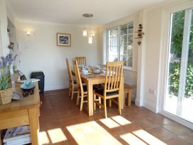 A dining room with a table and chairs at Mount Pleasant in Padstow