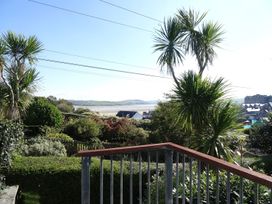 A garden with palm trees and a view at Mount Pleasant in Padstow