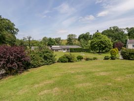 An outdoor area with trees and a building at Shearers in Llandysul