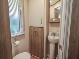 A bathroom with a sink and toilet at Caravan
