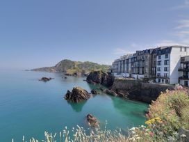 A coastal view with buildings near the sea at Val's Seaview Ilfracombe