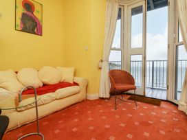 A living room with a sofa and coffee table at Val's Seaview in Ilfracombe