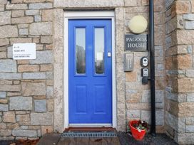 An entrance with a blue door and sign at Pagoda House in St. Austell
