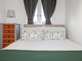 A bedroom with a bed and a drawer unit at 18 Pagoda Drive St. Austell