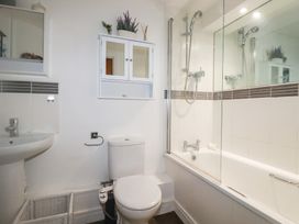 A bathroom with a sink, toilet, and bathtub at 18 Pagoda Drive, St. Austell
