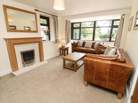 A living room with sofas and a coffee table at The Coach House in Carnforth