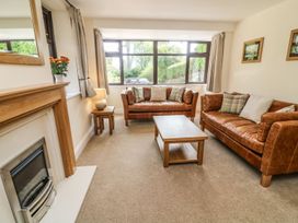 A living room with two sofas and a coffee table at The Coach House in Carnforth