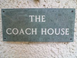 Name plaque displaying The Coach House in Carnforth