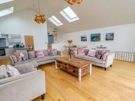 A living room with sofas and a coffee table at 2 Remera St. Ives