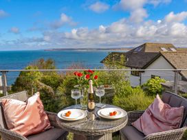 A table with champagne and strawberries on an outdoor terrace at 2 Remera in St. Ives
