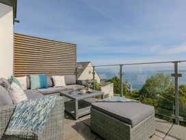 An outdoor seating area with a sofa and coffee table at 2 Remera St Ives