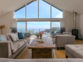 A living room with a coffee table and sofas at 2 Remera in St Ives