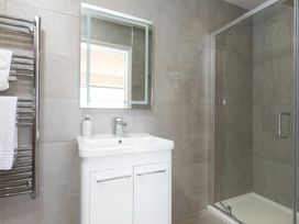 A bathroom with a shower and sink at 2 Remera St Ives