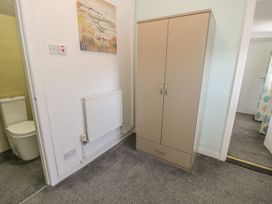 A cabinet and toilet in a bathroom at Falconers Cottage