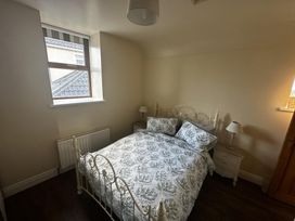 A bedroom with a bed and nightstands at The Rocks in Newry