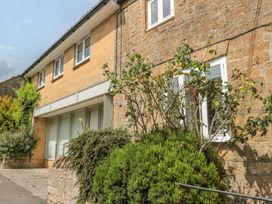 An outdoor view of a building with windows and greenery at Greenham Rise Norton-Sub-Hamdon