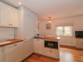A kitchen with cabinets and a countertop at Greenham Rise in Norton-Sub-Hamdon