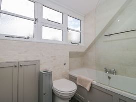A bathroom with a bathtub and toilet at Greenham Rise in Norton-Sub-Hamdon