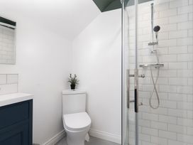 A bathroom with a shower and sink at The Cottage in Helston