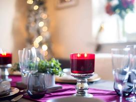 A dining table with candle and glasses at 29 Chapel Street Appleby-In-Westmorland