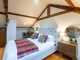 A bedroom with a bed and wooden furniture at 29 Chapel Street in Appleby-In-Westmorland