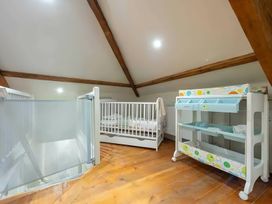 A nursery with two cribs and a changing table at 29 Chapel Street Appleby-In-Westmorland