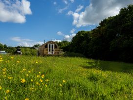 A glamping pod in a field with wildflowers at Glamping pod-Luxury Glamping Retreat in Battle
