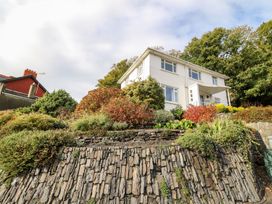 A house with a garden and pathway at Tymelyn in Aberystwyth
