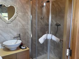 A bathroom with a shower and sink at Tylands in Camelford