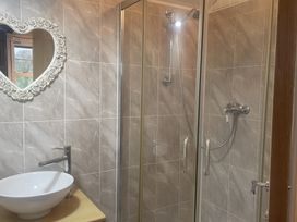 A bathroom with a shower and sink at Tylands in Camelford
