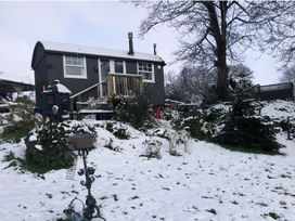 A shelter surrounded by snow in the garden at Tylands in Camelford